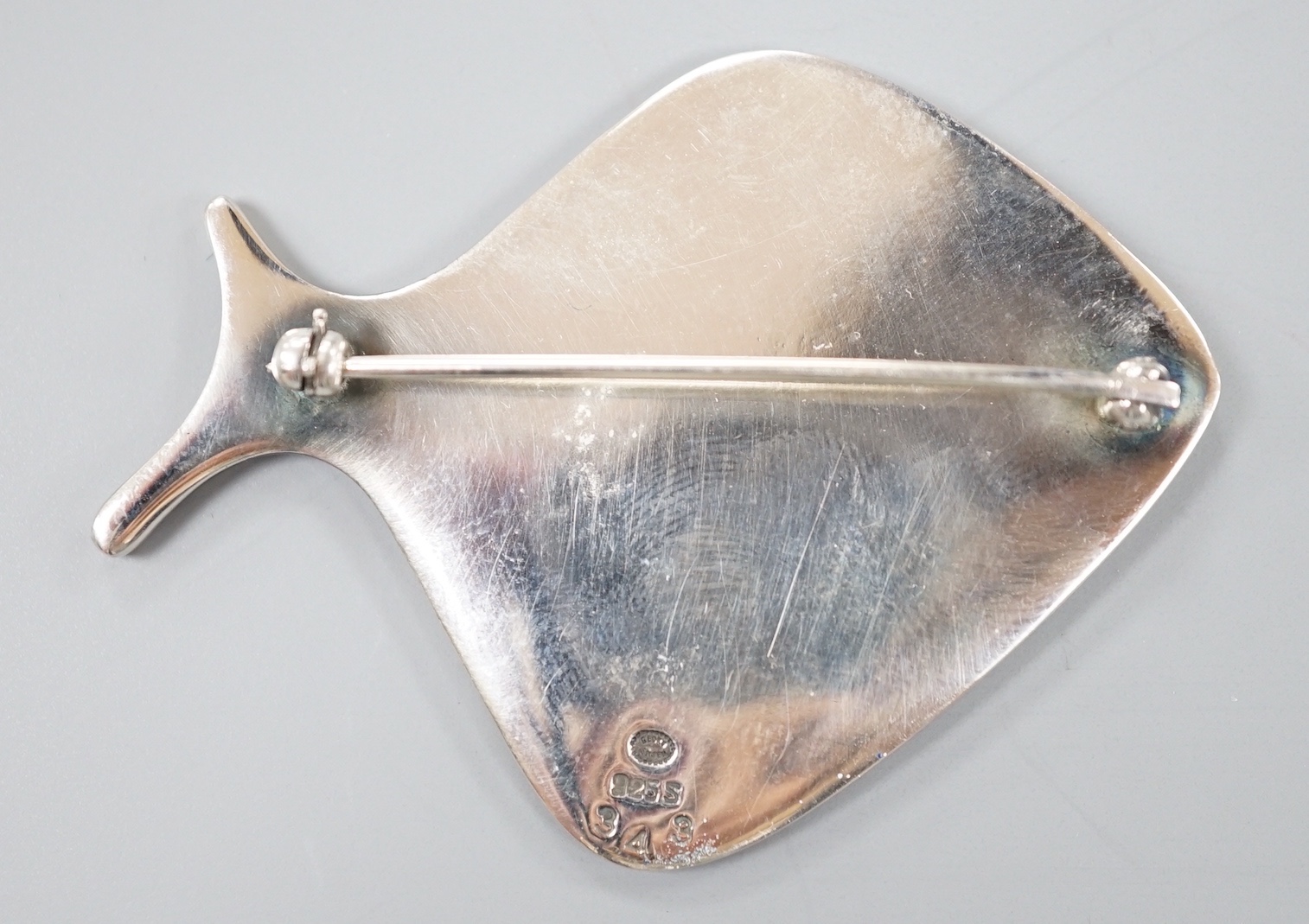 A Georg Jensen sterling and blue enamel stylised fish brooch, no. 343, 55mm.